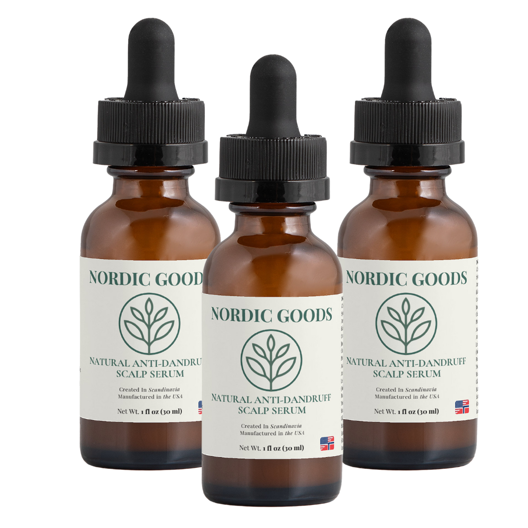 Three brown bottles of Nordic Goods scalp serum with dropper caps.
