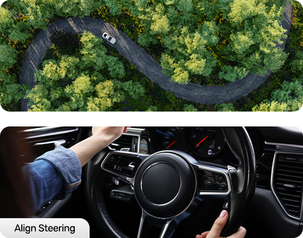 Aerial view of a car on a winding road; hands on a steering wheel.