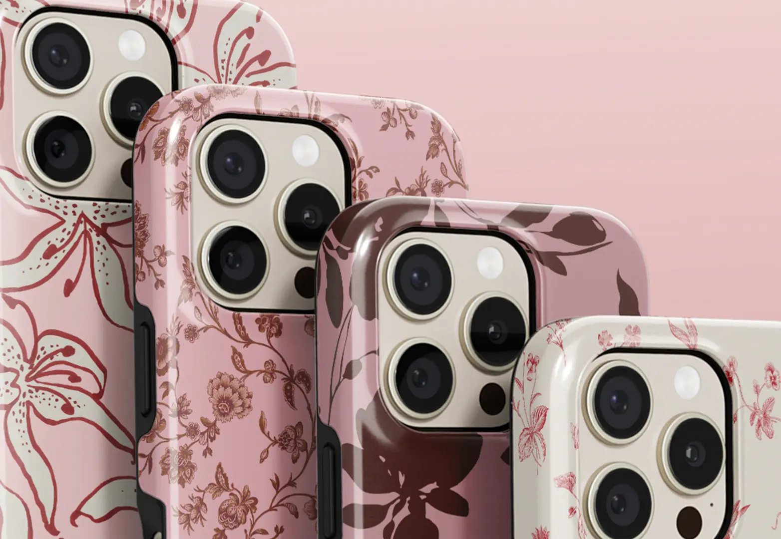 A close-up of four iPhones in pink and brown floral-patterned cases, arranged in a diagonal line.