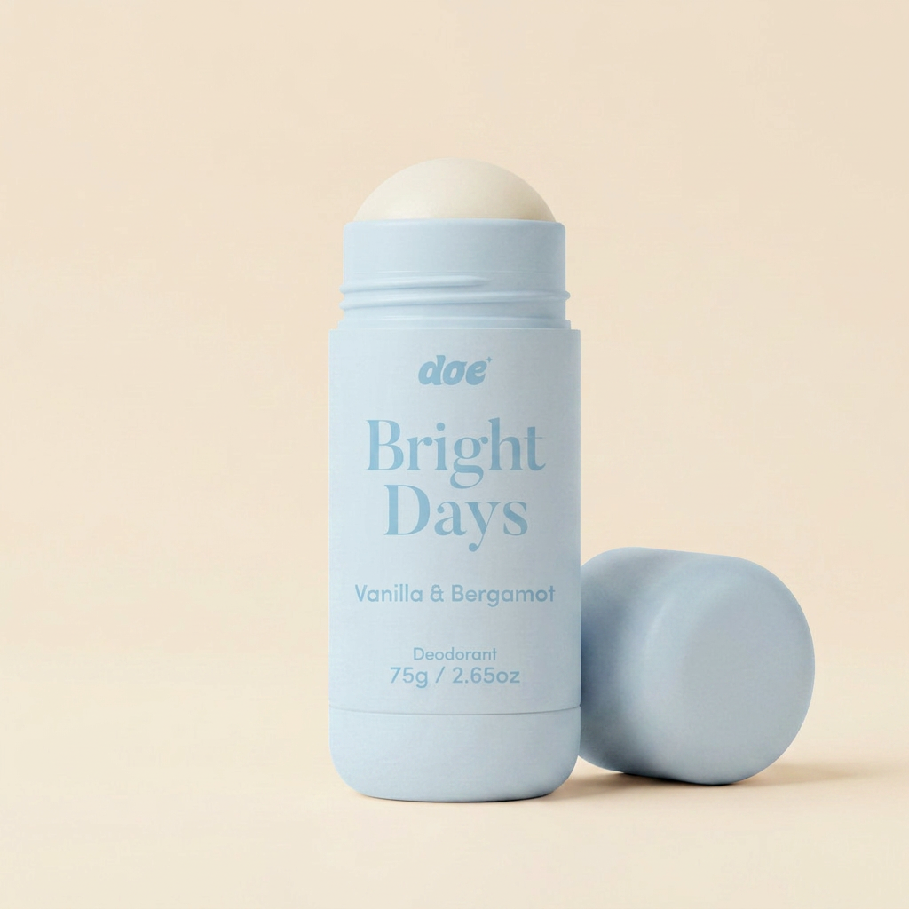 A light blue stick of Doe's Bright Days deodorant in Vanilla & Bergamot, with the cap off.