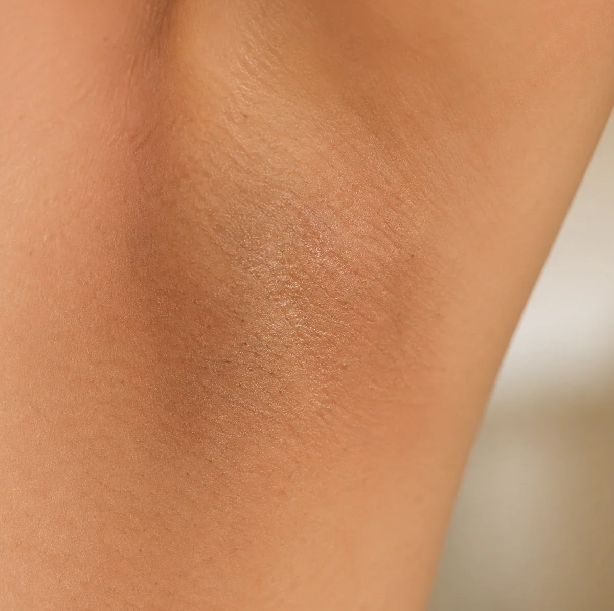 A close-up macro shot of a person's armpit skin.