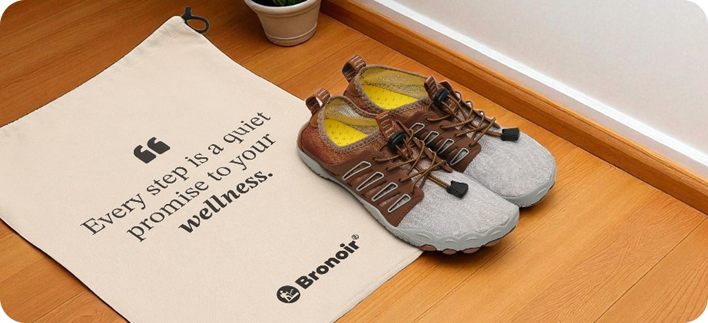 Gray and brown shoes beside a bag with a motivational quote.
