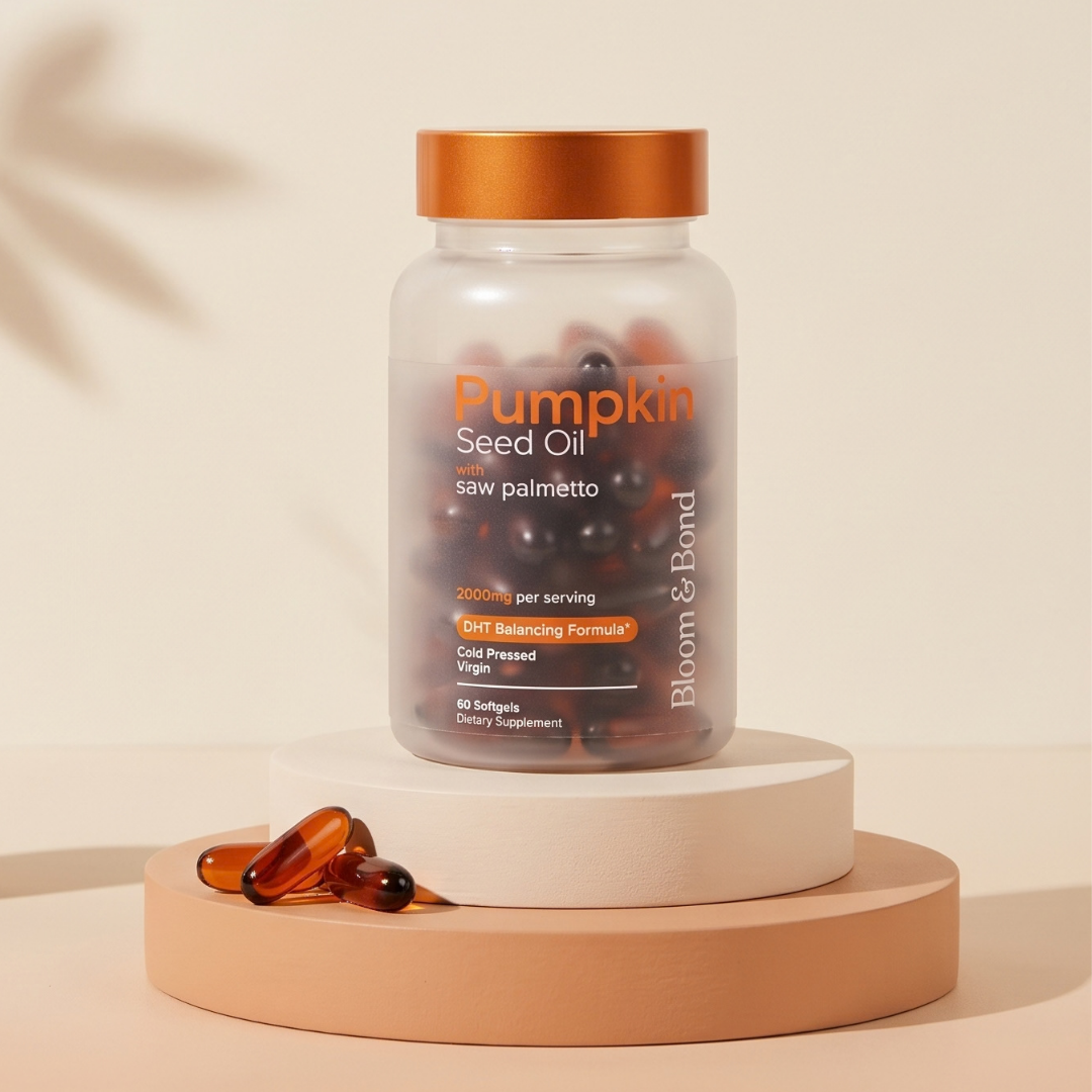 A bottle of Bloom & Bond Pumpkin Seed Oil with saw palmetto softgels on a tiered pedestal.
