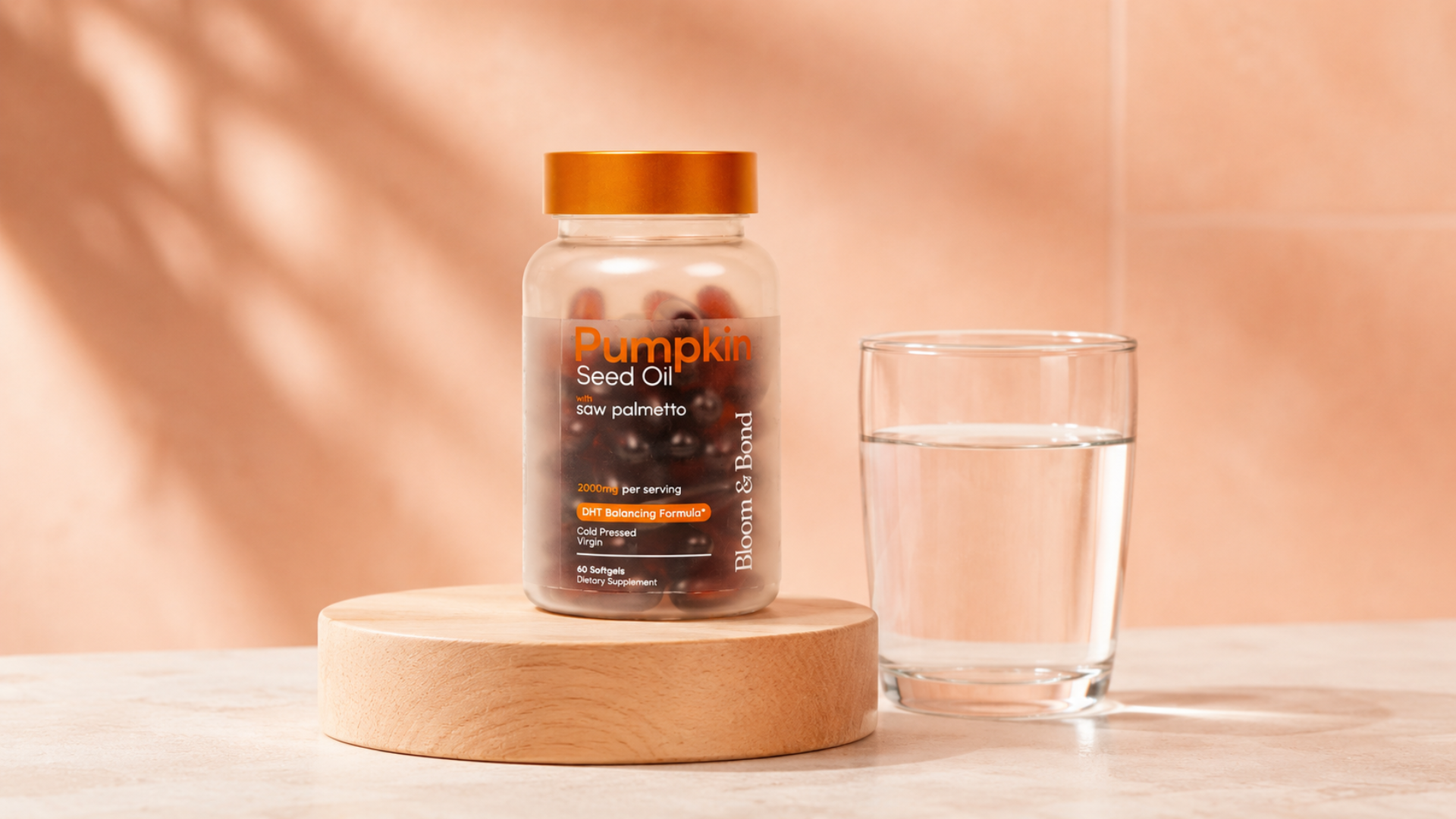 A bottle of Pumpkin Seed Oil supplements on a wooden pedestal next to a glass of water.