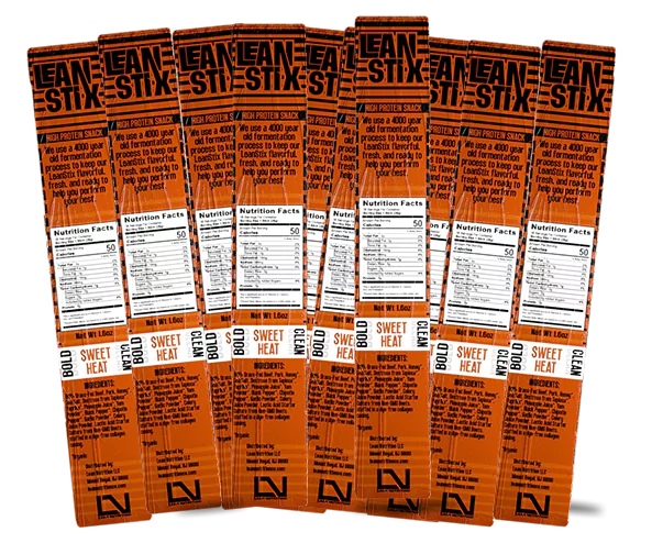 Several orange Lean Stix snack packages with nutrition facts visible.