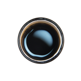 Top view of a cup filled with dark liquid, possibly coffee.