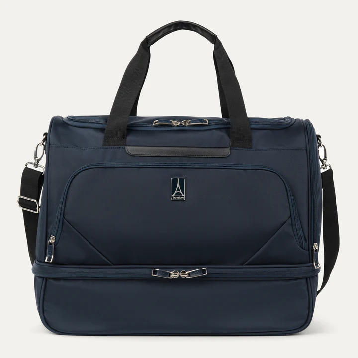Dark blue travel bag with black handles and multiple zippers.
