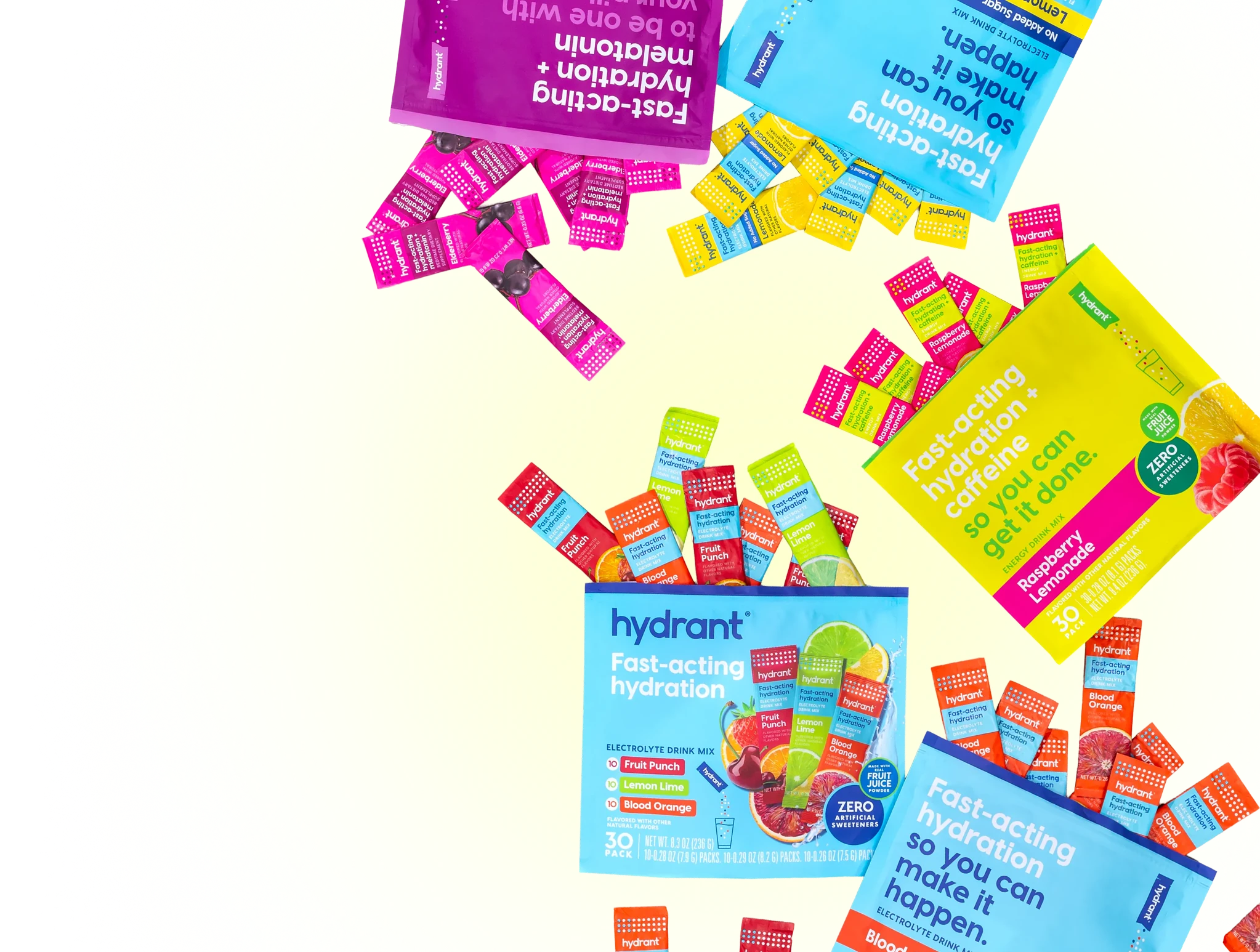 A variety of colorful Hydrant electrolyte drink mix packets scattered against a light background.