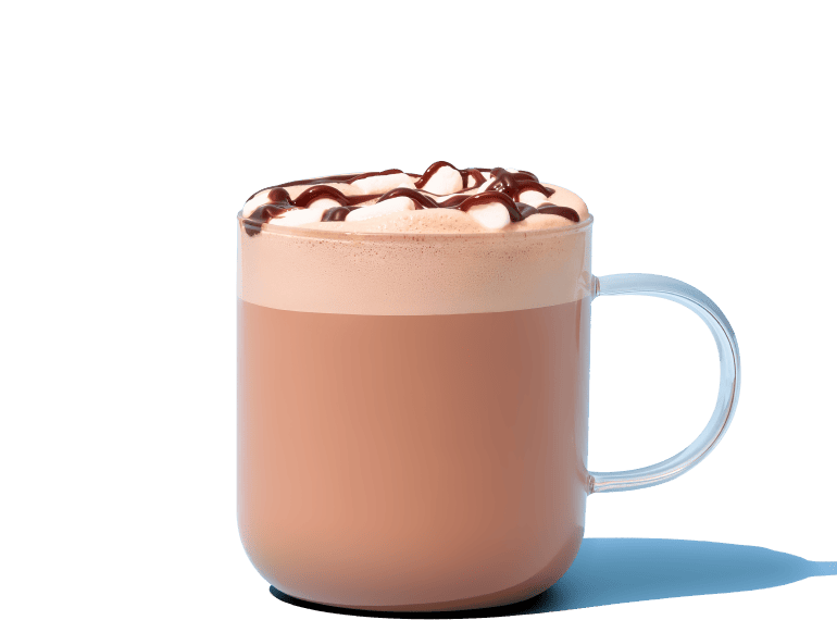 Glass mug filled with hot chocolate, topped with marshmallows and chocolate drizzle.