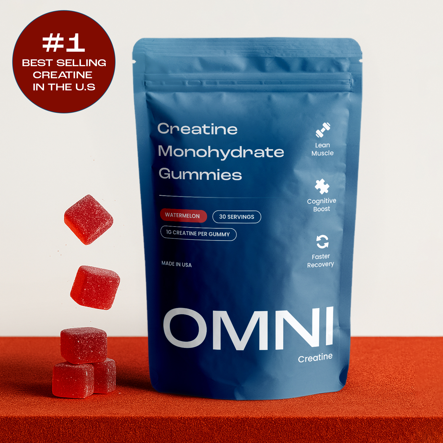 Blue bag of creatine gummies with red gummies beside it.