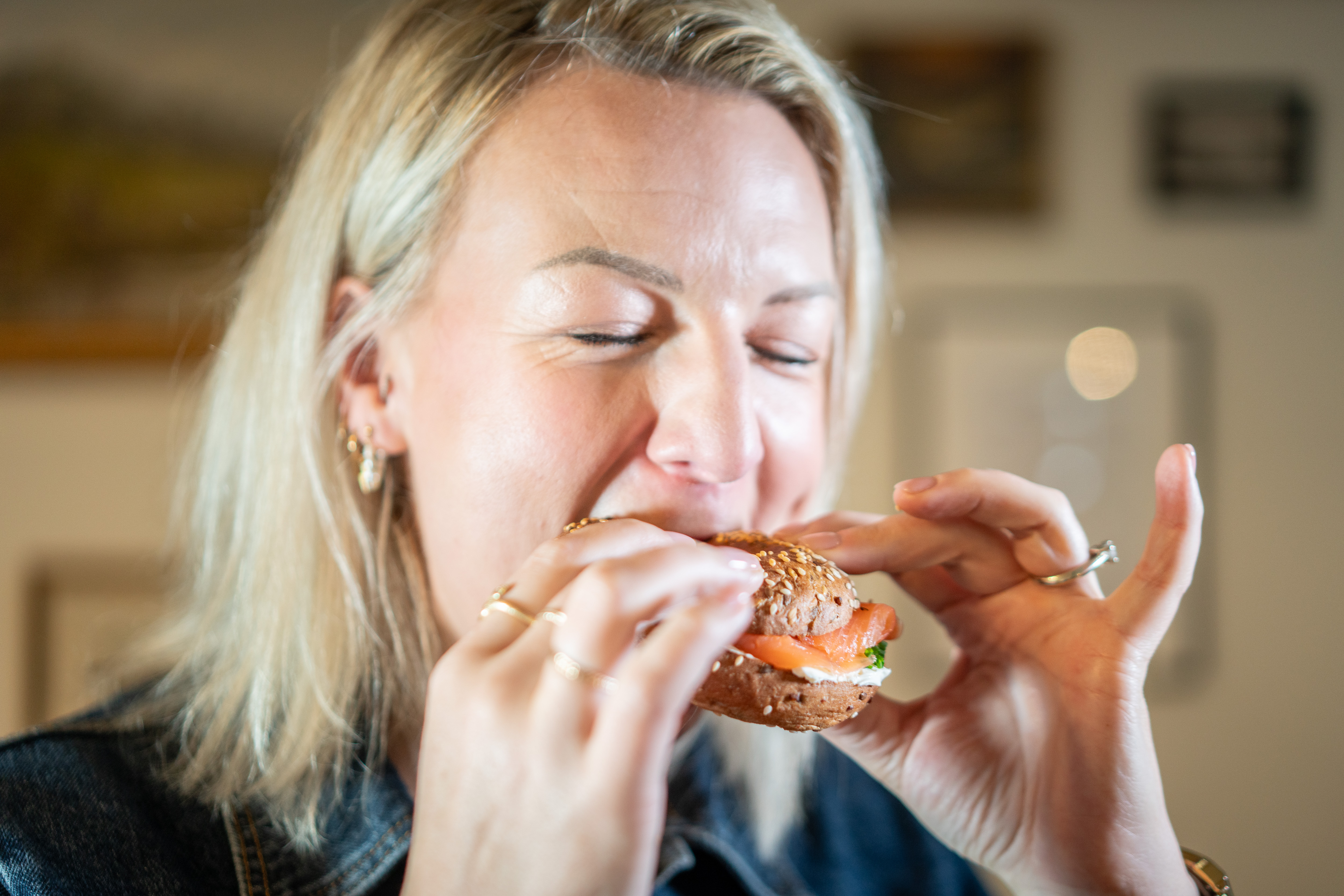 Person eating a bagel.