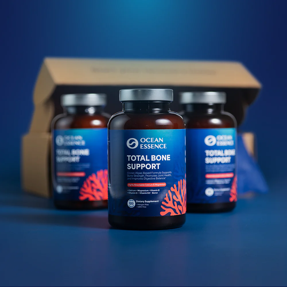 Three Ocean Essence Total Bone Support supplement bottles arranged on a blue background.
