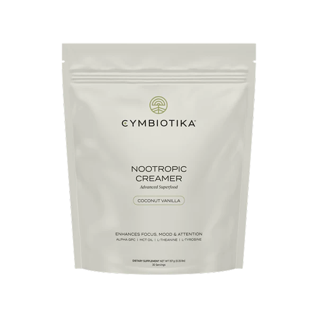 A white package labeled 'Cymbiotika Nootropic Creamer Coconut Vanilla.'
