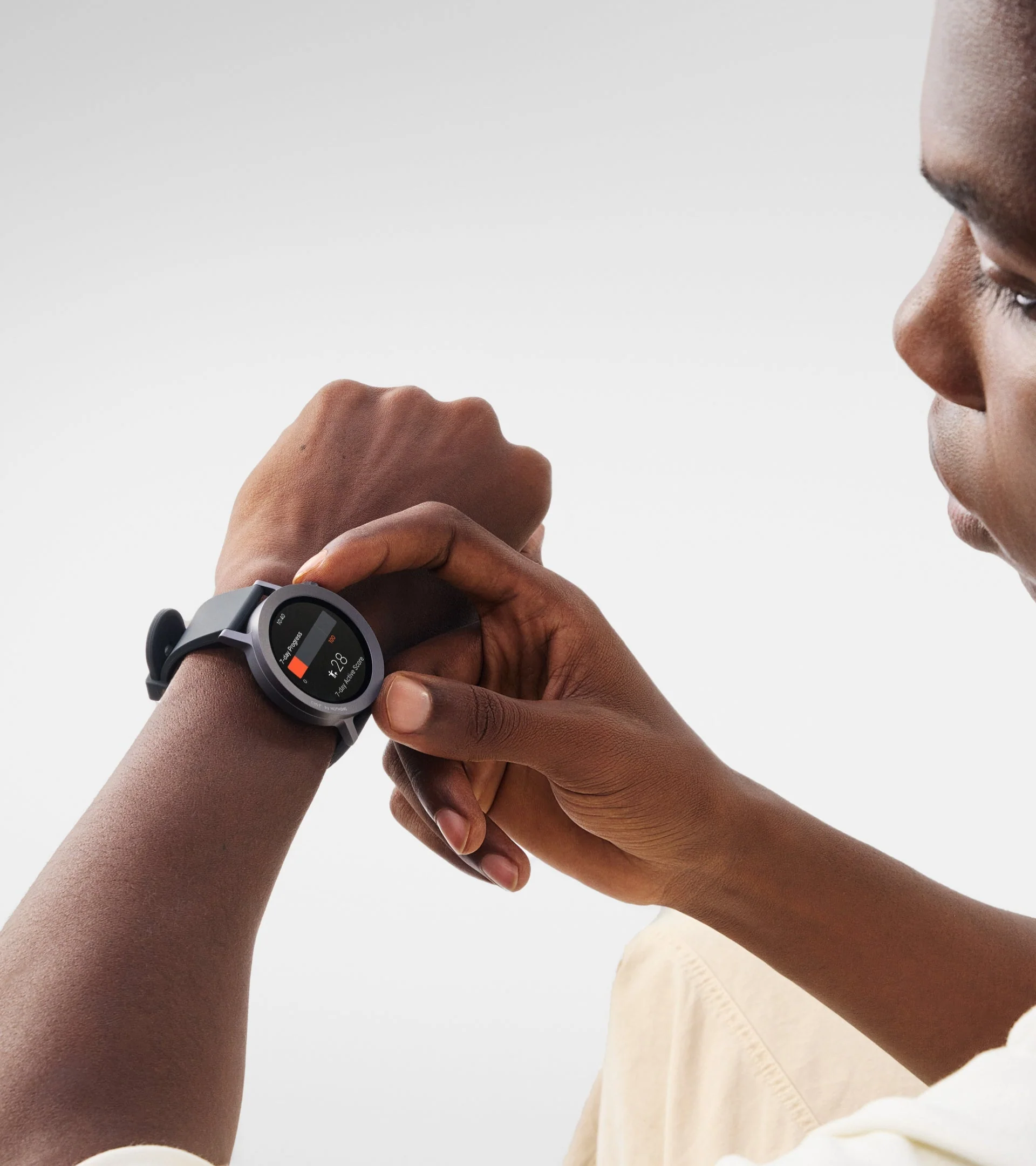 Person interacting with a smartwatch on their wrist.