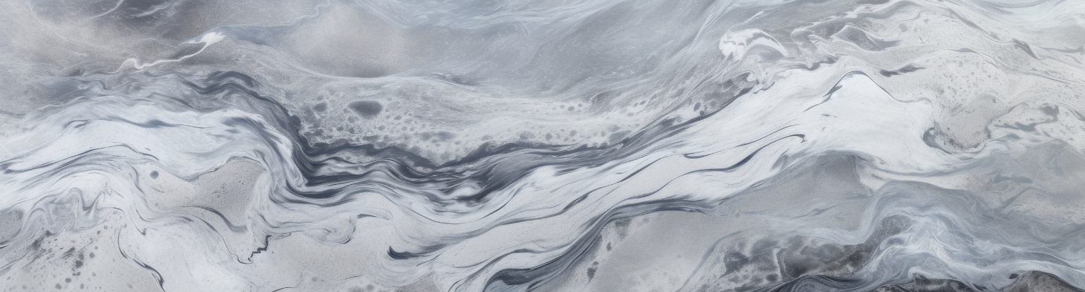 Abstract gray and white marble texture with swirling patterns.