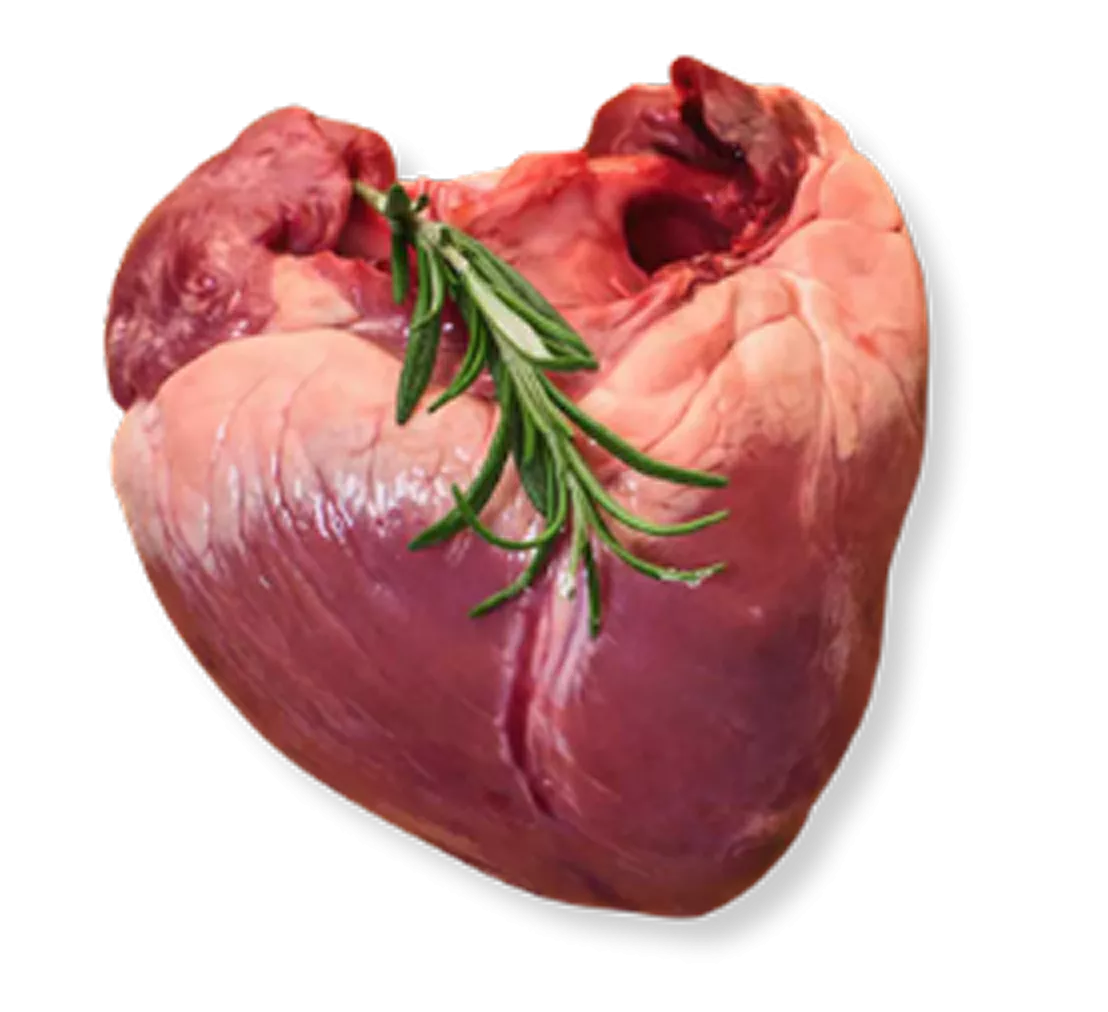A close-up of a raw animal heart garnished with a sprig of fresh rosemary.