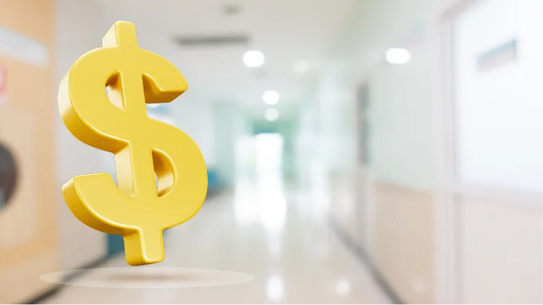A large, golden dollar sign floats in a brightly lit, blurred hallway, possibly a hospital or clinic.