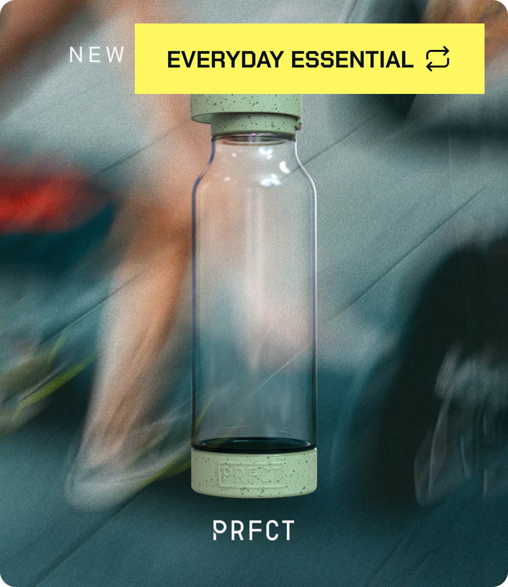 Transparent bottle with green cap, text 'NEW EVERYDAY ESSENTIAL PRFCT' over blurred background.