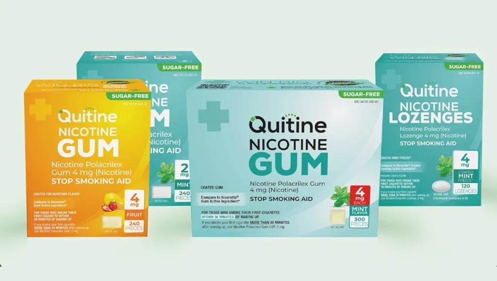 Various Quitine nicotine gum and lozenge packages for stopping smoking.