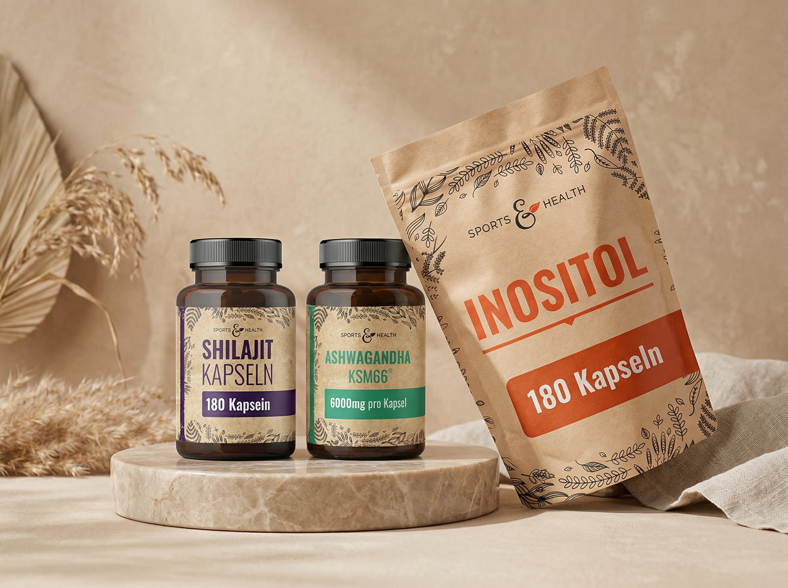 Two bottles and one pouch of Sports & Health brand supplements on a marble pedestal.