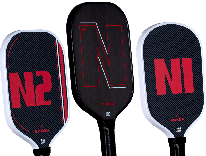 Three pickleball paddles with red and black designs labeled N1, N2, and N3.