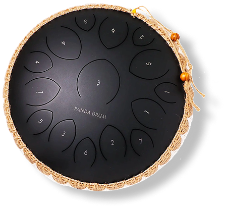 Black steel tongue drum with numbered notes and decorative rope edge.