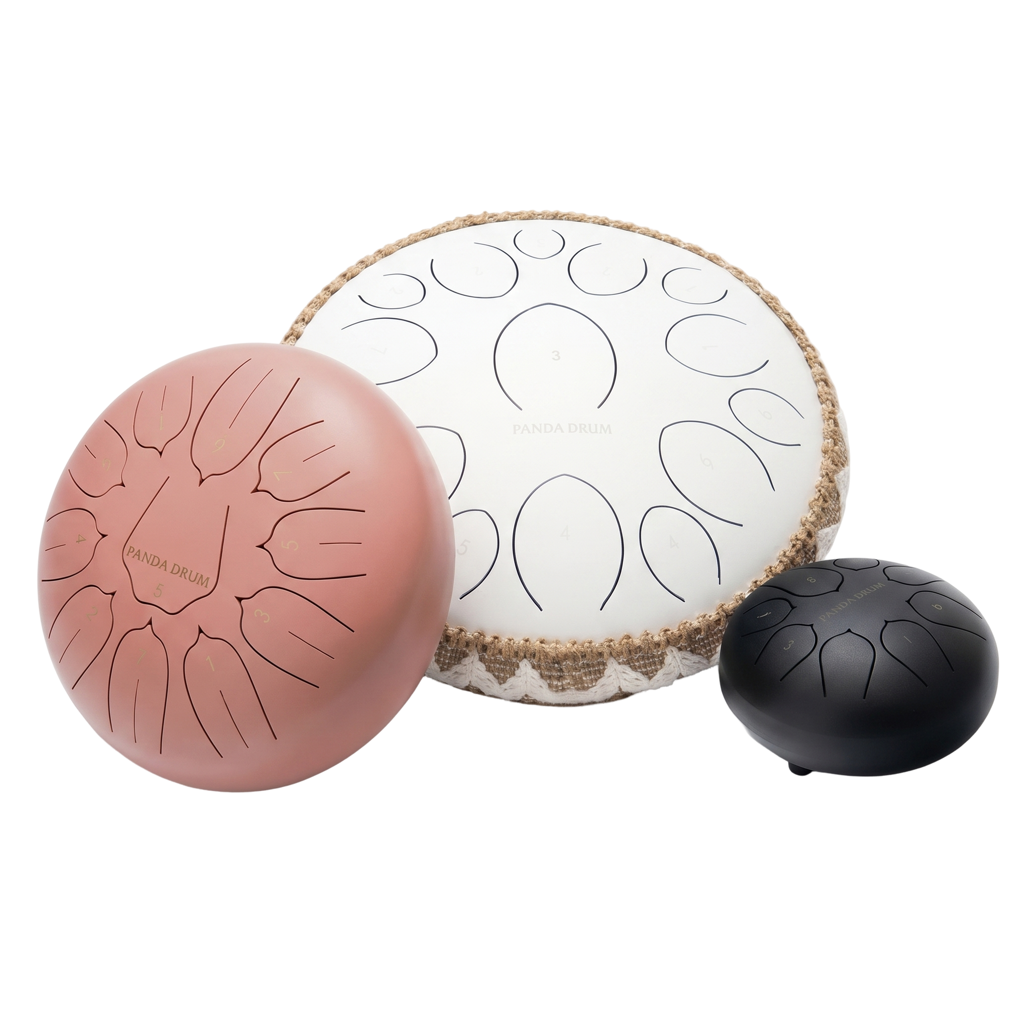 Three different sized steel tongue drums in pink, white, and black, set against a white background.