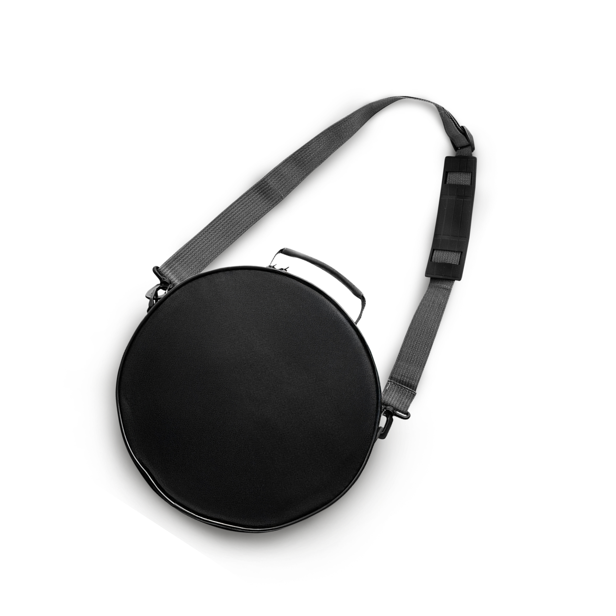 A round, black carrying case with a grey shoulder strap and a top handle on a white background.