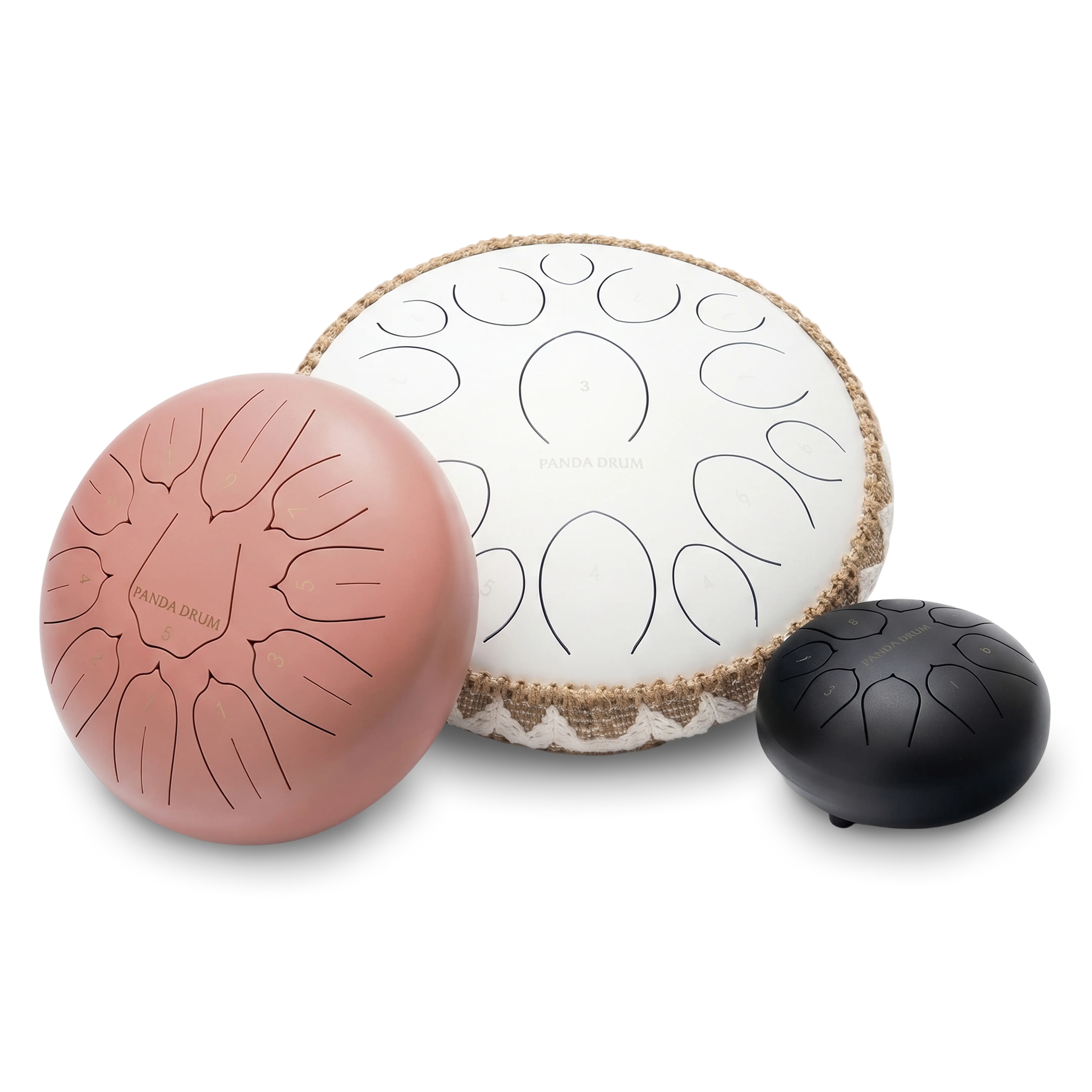 Three different sized steel tongue drums in pink, white, and black against a white background.