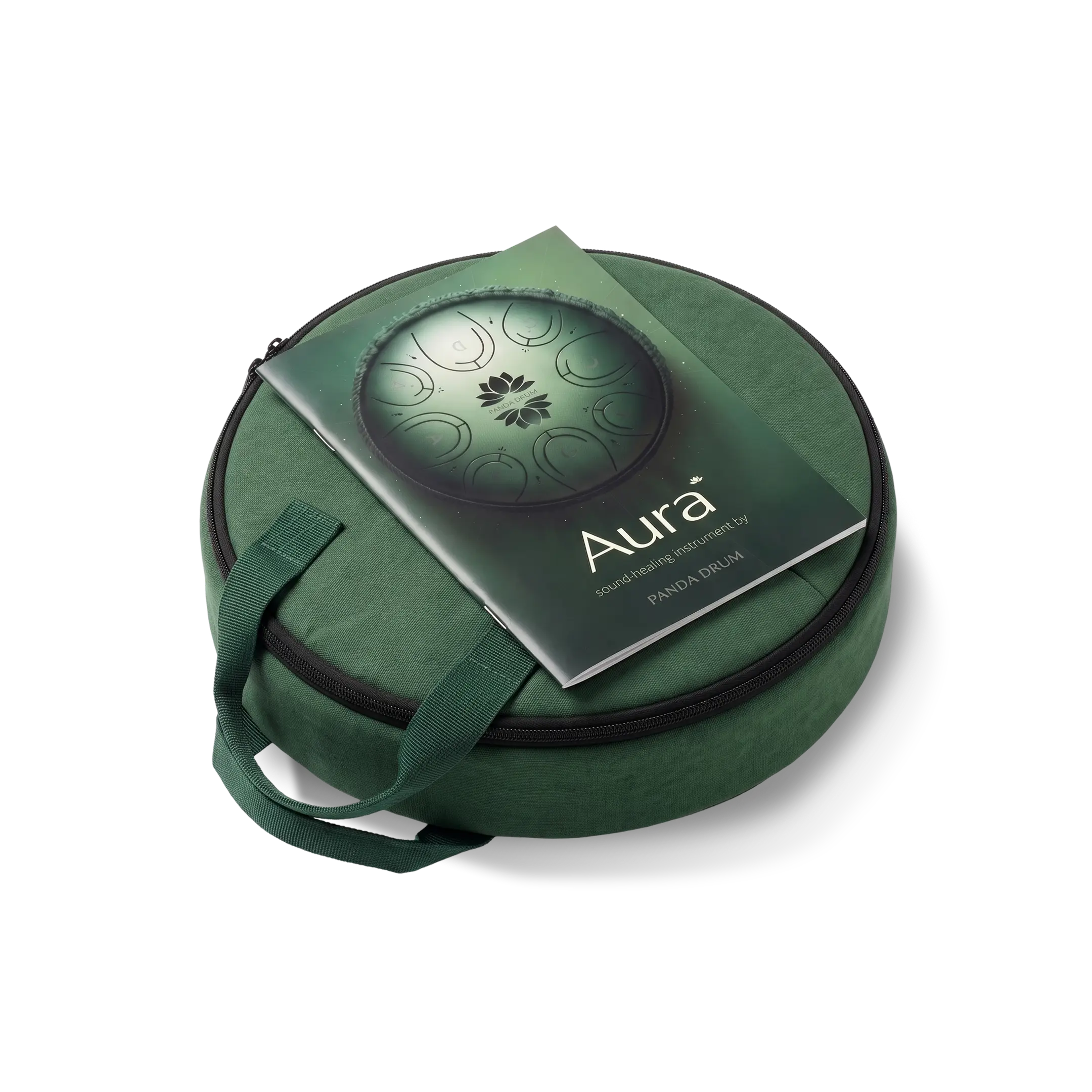 A green Aura Panda Drum carrying case with its instruction booklet resting on top.