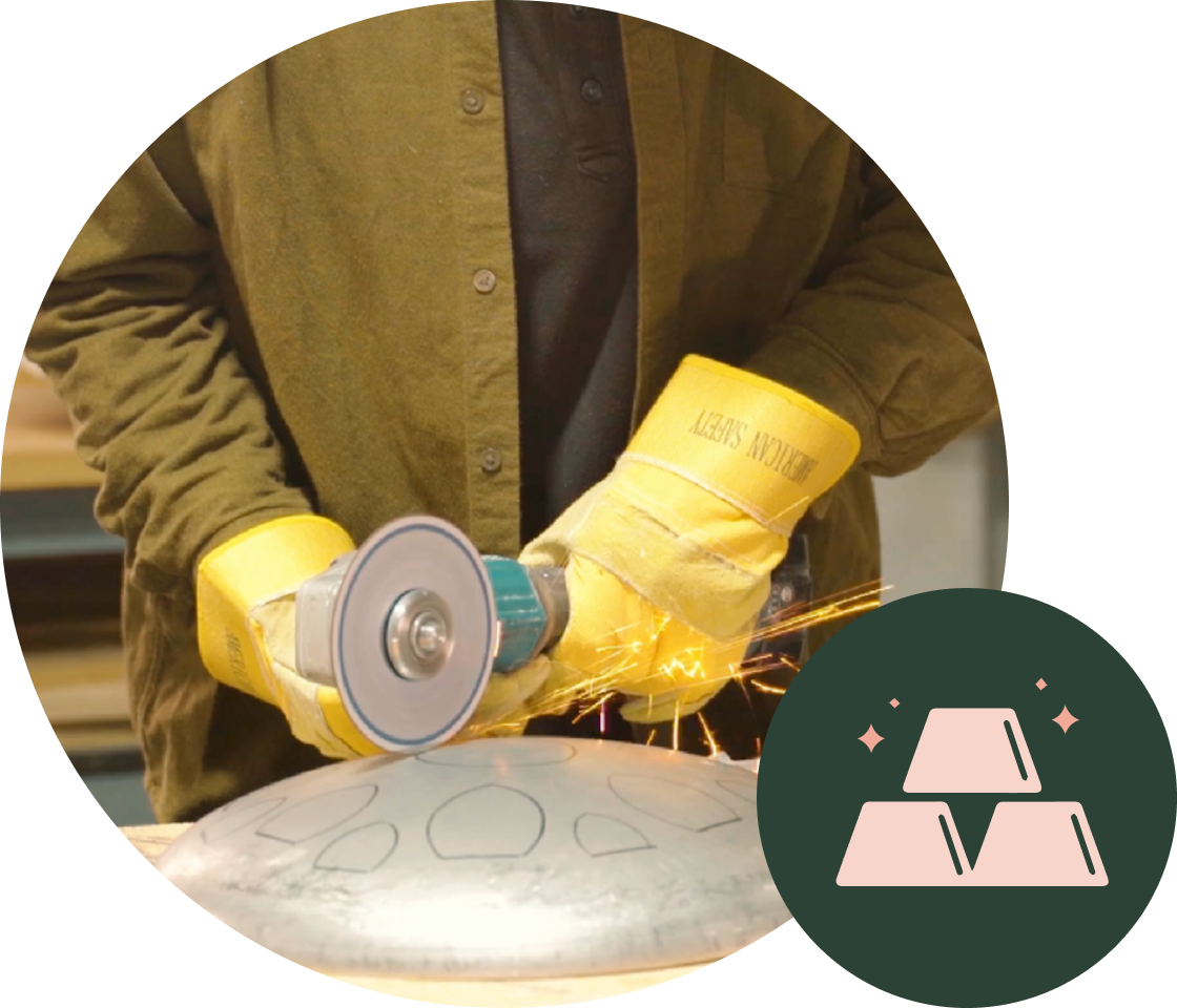 Person using an angle grinder on metal with sparks flying.