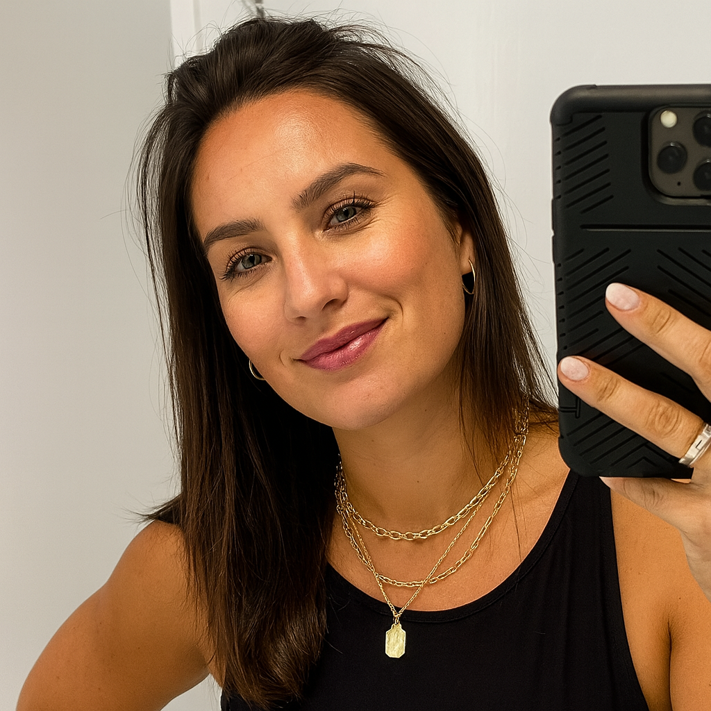 Person taking a selfie in a mirror with a smartphone.