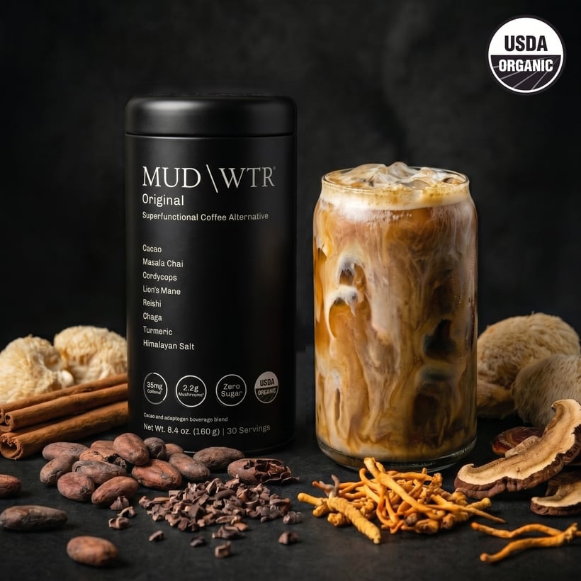 MUD\WTR tin with an iced mud latte and raw ingredients