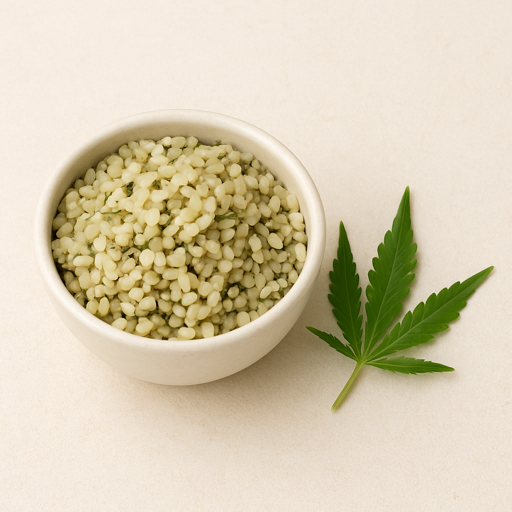 Bowl of hemp seeds with a cannabis leaf on the side.