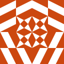 An orange and white symmetrical geometric pattern with a central star-like design.