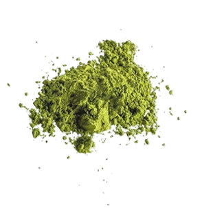 Green powder scattered on a white background.