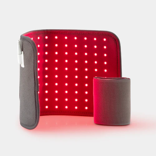 Red LED light therapy pad with a rolled-up gray strap.