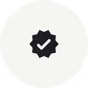 Black checkmark inside a starburst shape on a white background.
