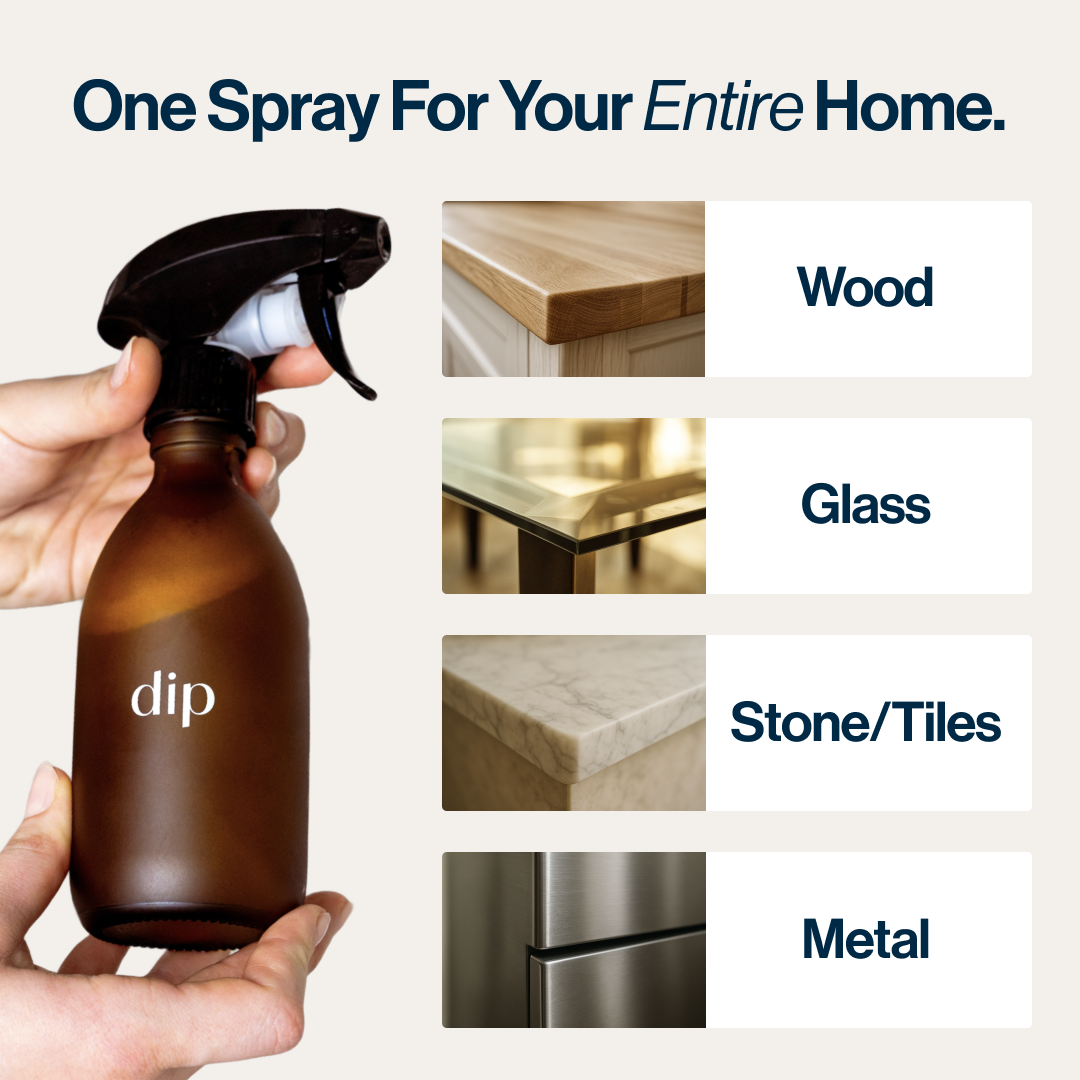 Hand holding a spray bottle labeled 'dip' with surfaces: wood, glass, stone/tiles, metal.