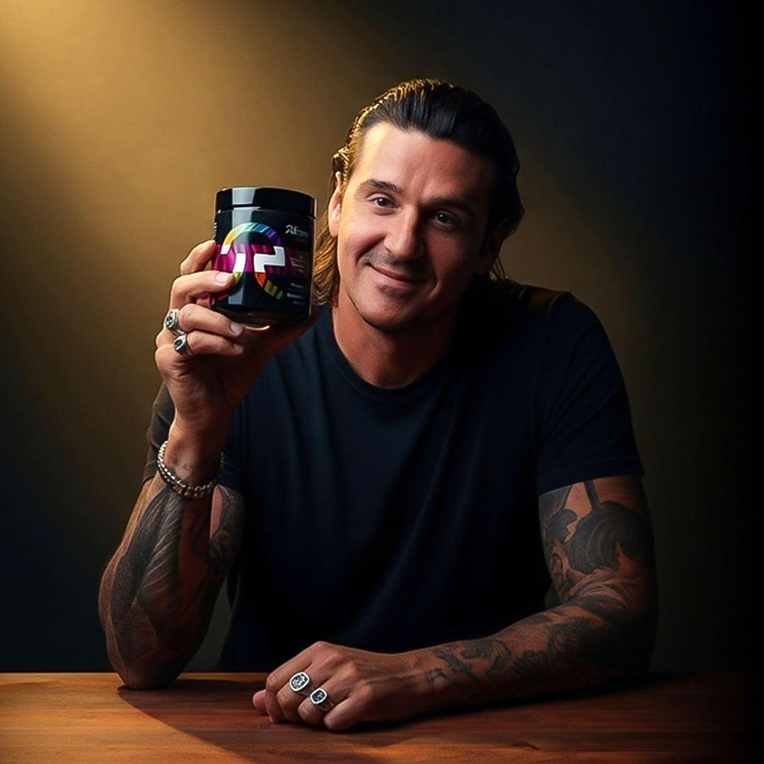 Person in black shirt holding a colorful jar, smiling.