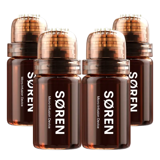 Four SØREN Micro-Infusion Device bottles with copper-toned microneedle applicator tops, against a white background.