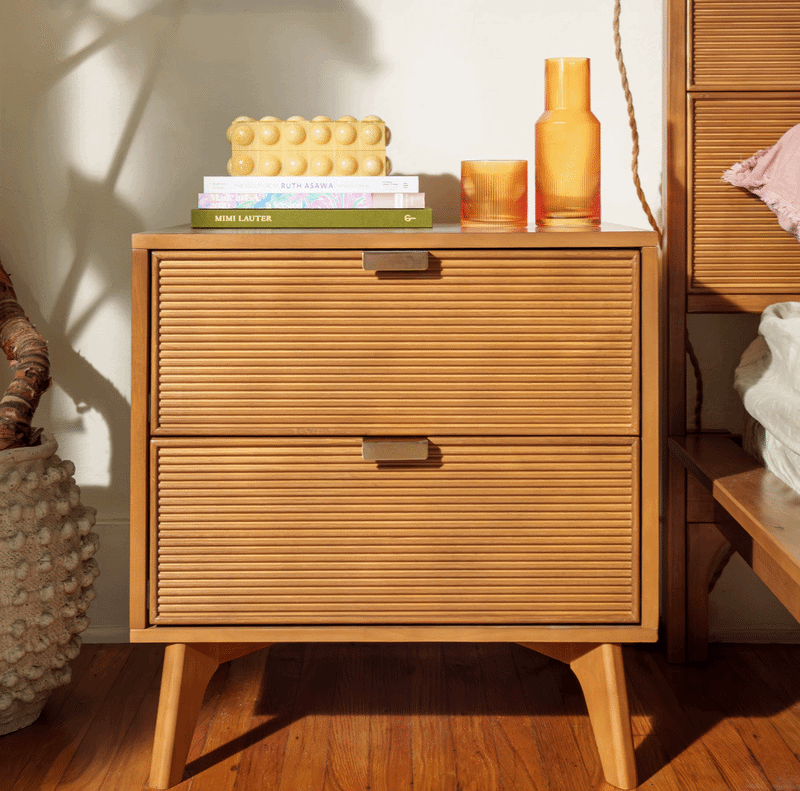 Modern, pecan 2-drawer dresser with maximalist bedroom furniture.