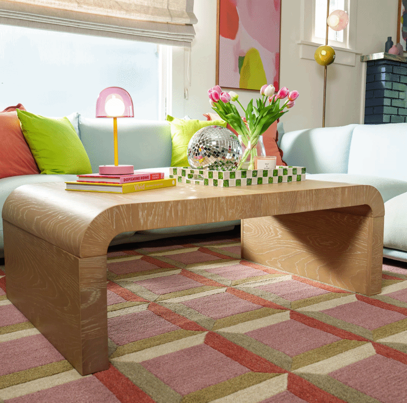 Maximalist living room with modern, rounded corner coffee table.