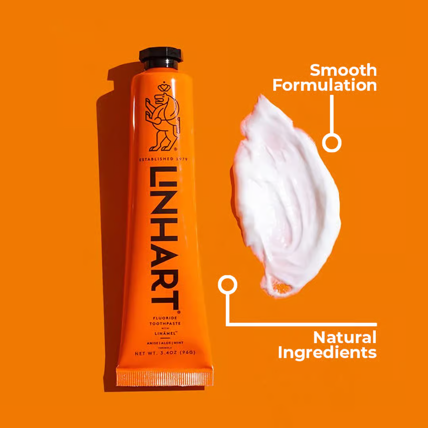 Orange toothpaste tube with white paste, labeled 'Smooth Formulation' and 'Natural Ingredients.'