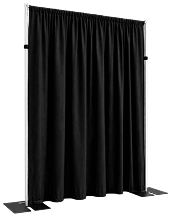 A portable backdrop stand with a pleated black curtain hanging from a silver frame against a white background.