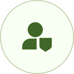 Green silhouette of a person with a shield in a circle.