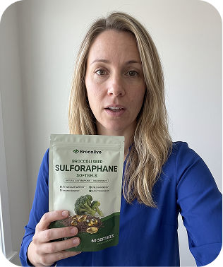 A woman in a blue shirt holds a pouch of Brocolive Broccoli Seed Sulforaphane Softgels.