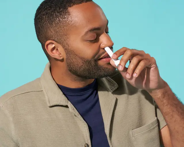 Man inhaling from a BoomBoom Nasal Stick