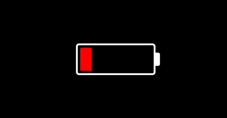 A graphic icon of a battery with a low charge level, indicated in red, on a black background.