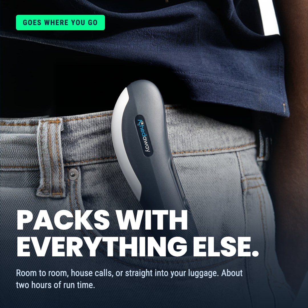 A close-up of a handheld Achedaway device tucked into the back pocket of a person's jeans.